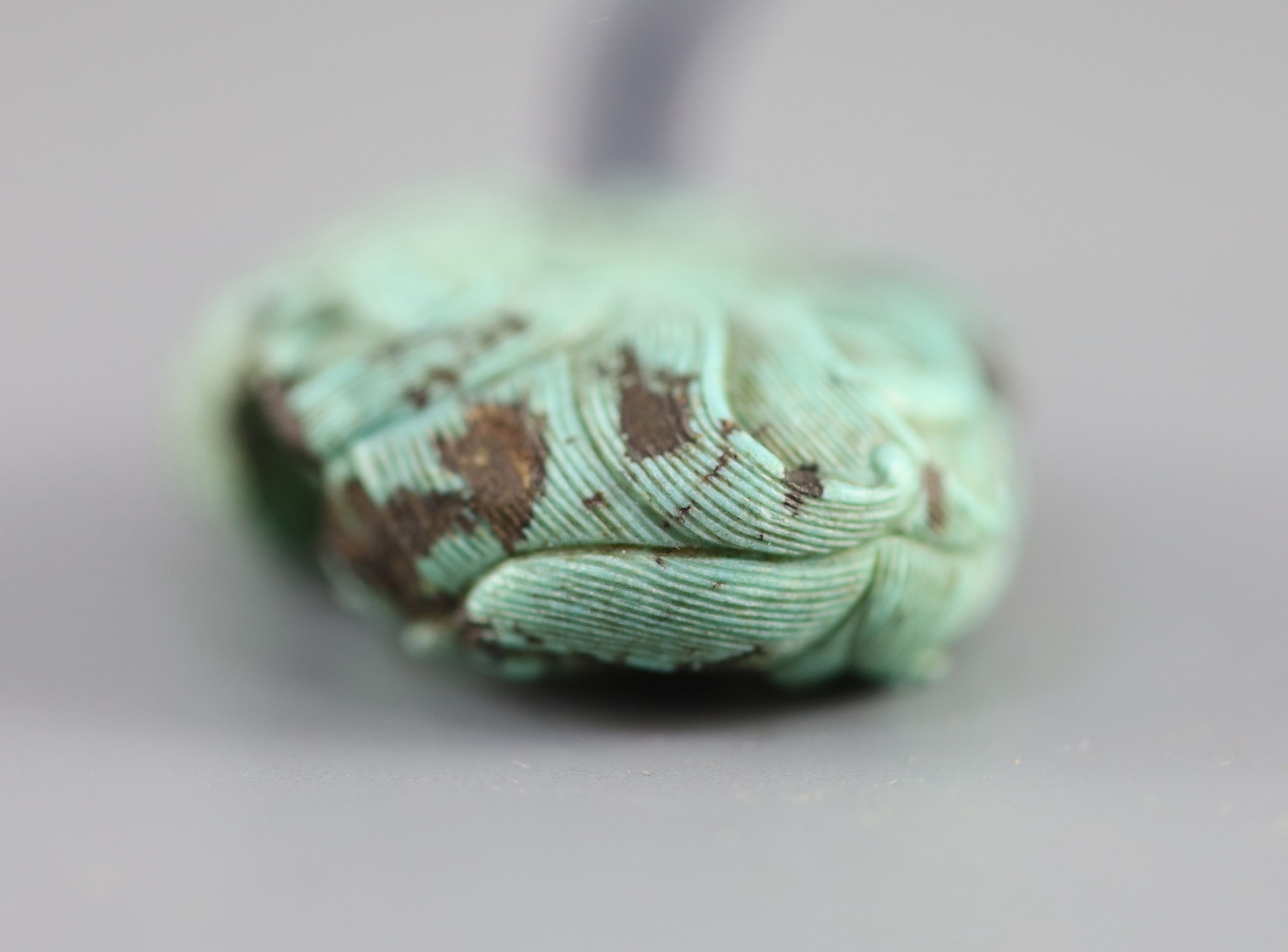 A Chinese turquoise matrix ‘dragon’ pendant, 19th century 5.4cm long